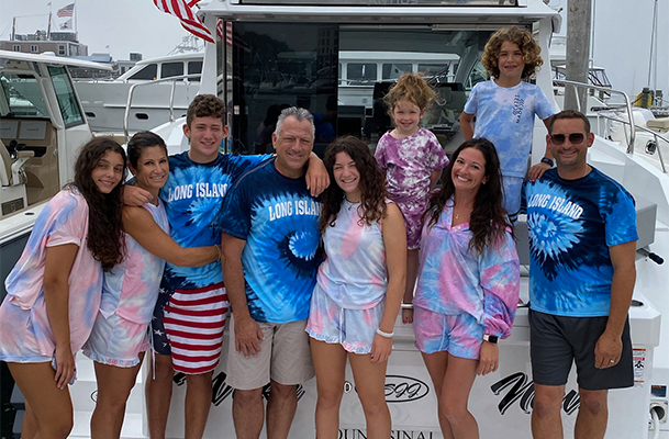 The Strong Family on their Cruisers Yachts boat docked