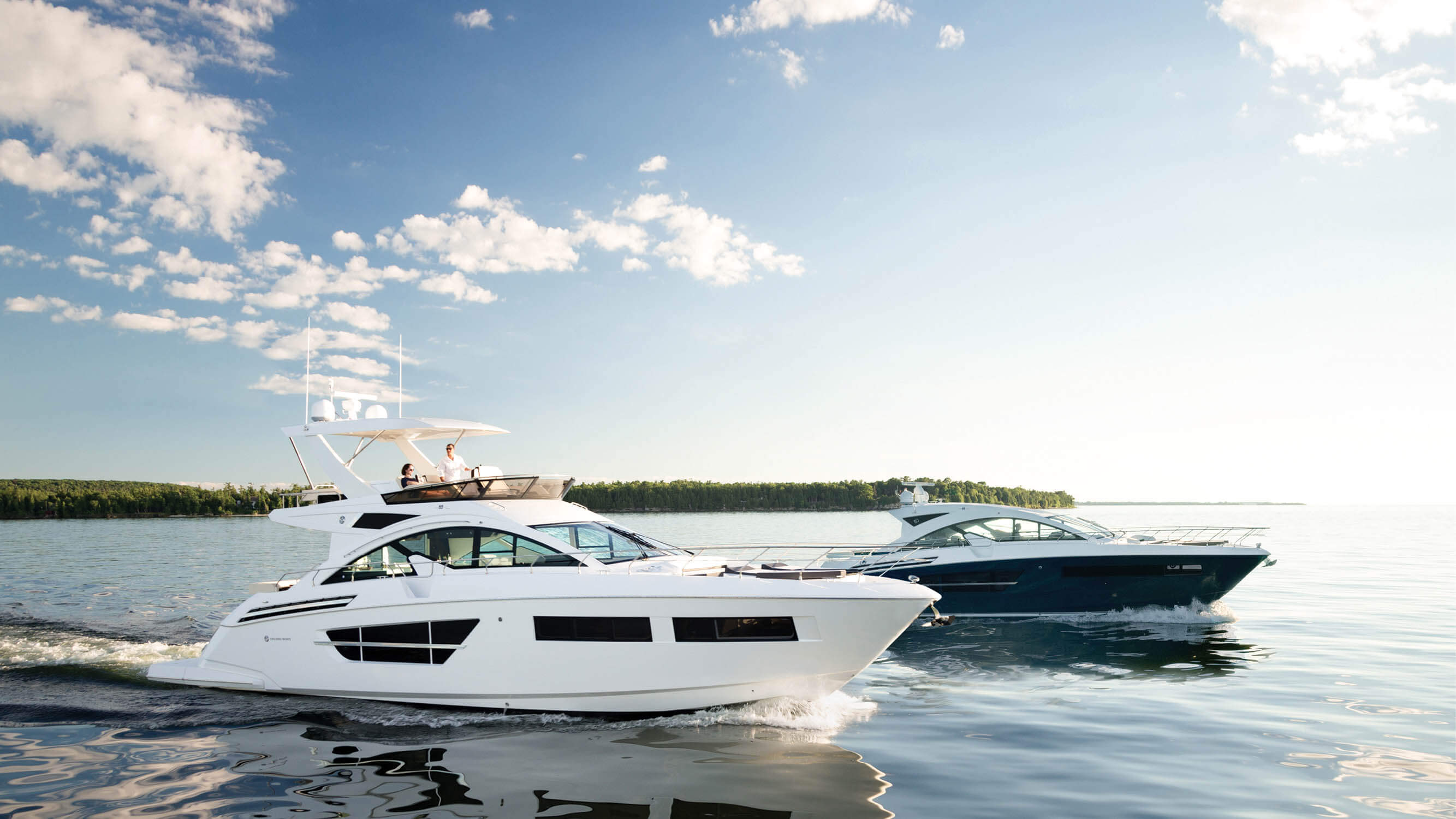 Two Cruisers Yachts Cantius Boats on water