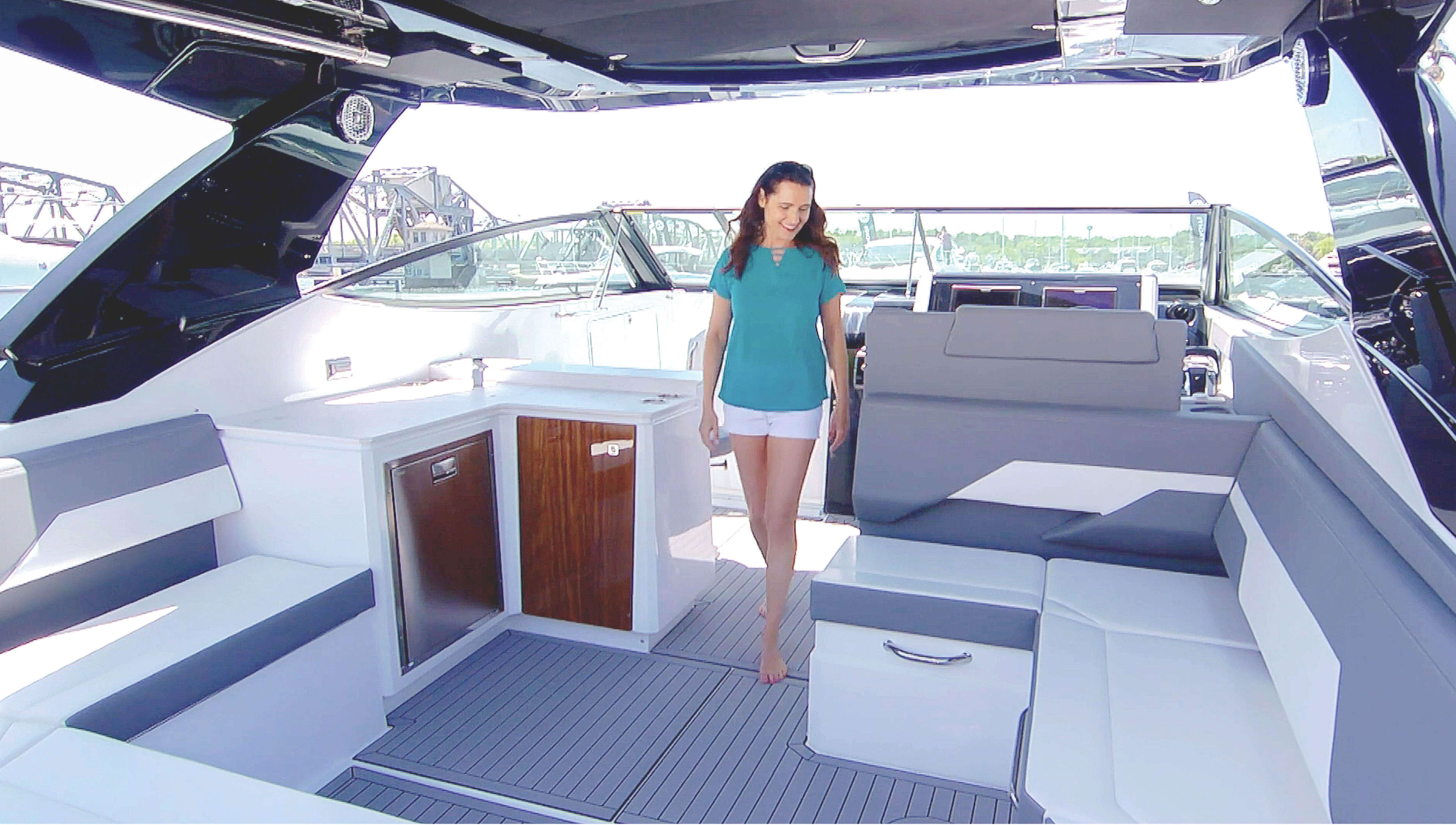 Woman standing in cockpit of Cruisers Yachts 38 GLS OB