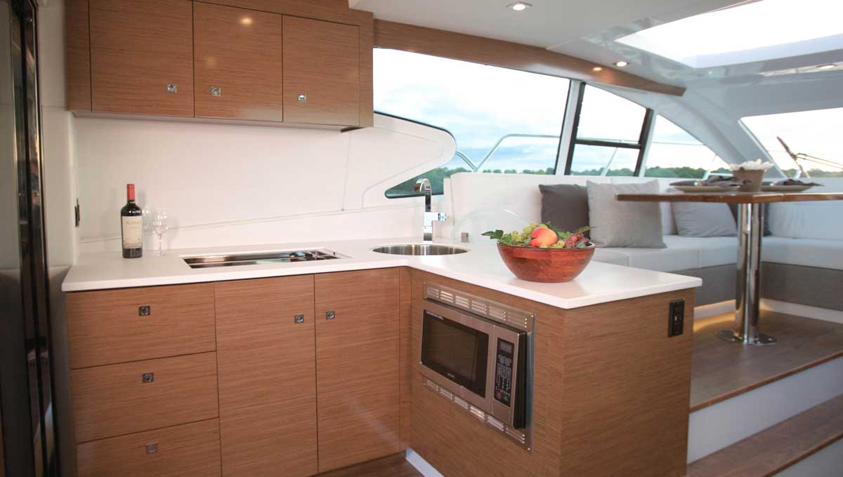 Cruisers Yachts 46 Cantius galley with brown cabinets