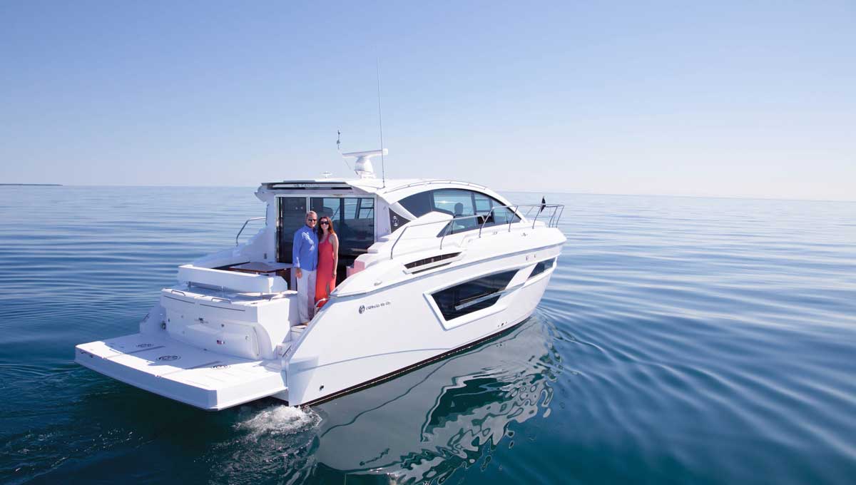 Couple standing on 46 Cantius aft deck