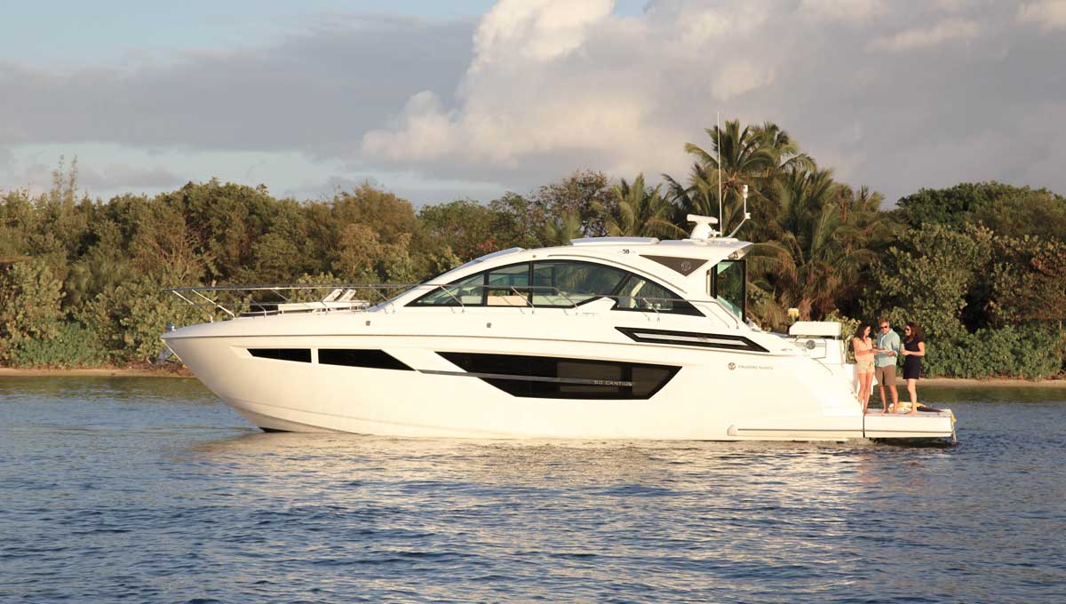 Cruisers Yachts 50 Cantius port side with people on aft deck