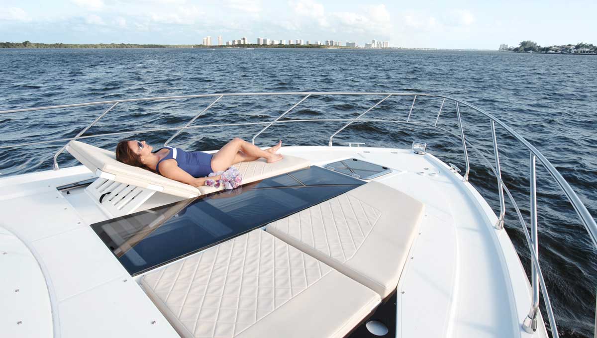 Woman on Cruisers Yachts 54 Fly bow seating