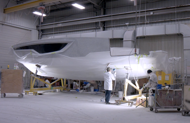 Cruisers Yacht getting painted in a factory