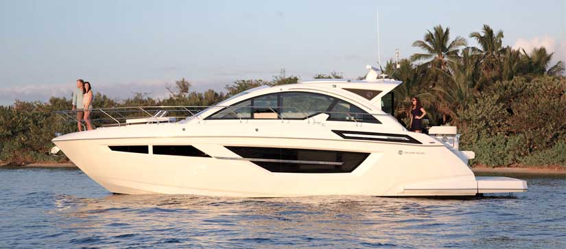 Couple on bow of Cruisers Yachts 50 Cantius