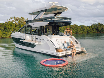 FLY series motoryacht docked at a marina, showcasing its flybridge design